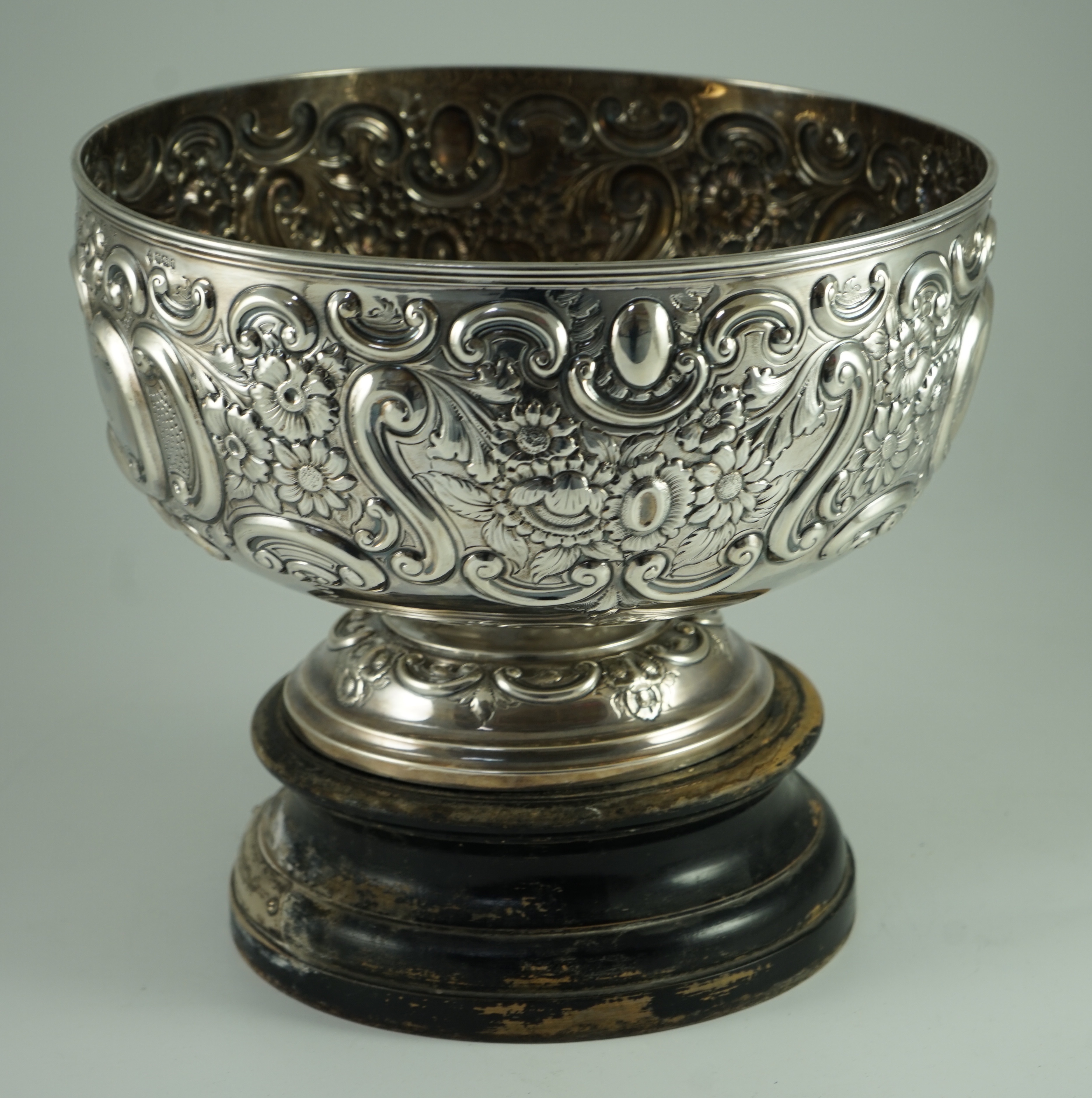 A late Victorian embossed silver pedestal punch bowl by Mappin Brothers (a.f.)